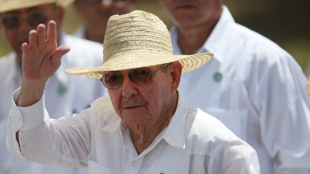 Cuban President Raul Castro waves after attending the Plaza de la Revolution Mass given by Pope Francis.