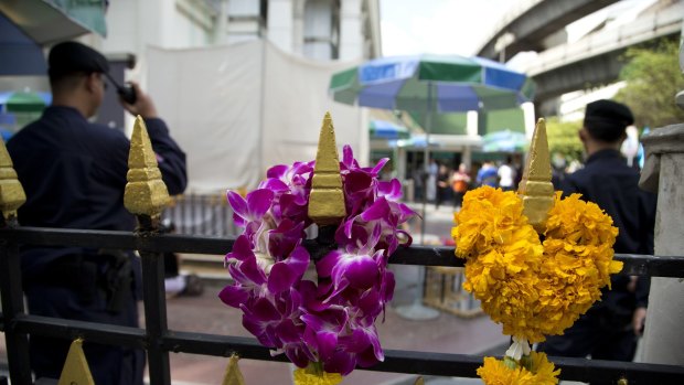 Police keep watch at the Erawan Shrine, the scene of the August 17 bombing, in Bangkok.