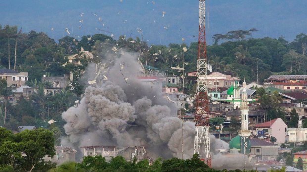 An explosion near a mosque as Philippine Air Force fighter jets bomb suspected locations of militants  in Marawi city.