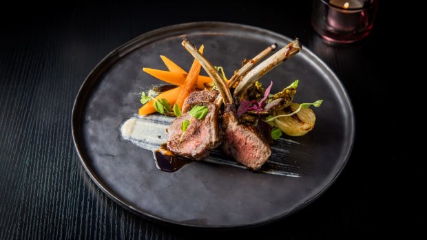 Char-grilled lamb rack with honey carrots, brussels sprouts and sweet miso mint sauce.