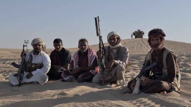 Yemeni fighters allied with the Saudi-led coalition fighting Houthi rebels visit a United Arab Emirates military base near Saffer, Yemen on September 14.