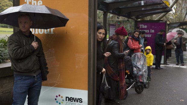 Commuters wait in Elizabeth Street on Friday. They'll have company soon.