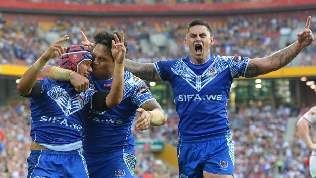 Pita Godinet of Samoa celebrates a try during the Four Nations match against England.  