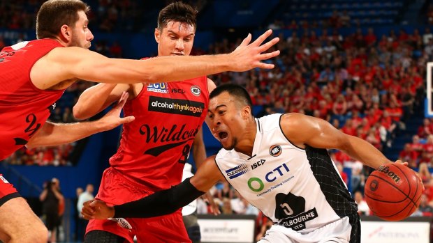 Halted: Stephen Holt can't get past the Wildcats during the round 10 NBL match at Perth Arena.