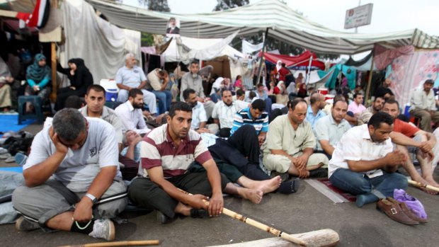Supporters of ousted president Mohamed Morsi sit-in at Rabaa Square, Cairlo in July 2013.