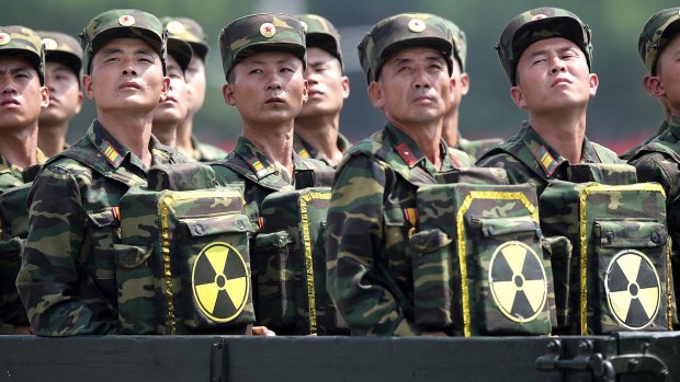 North Korean soldiers carrying packs marked with the nuclear symbol during a 2013 military parade in Pyongyang.