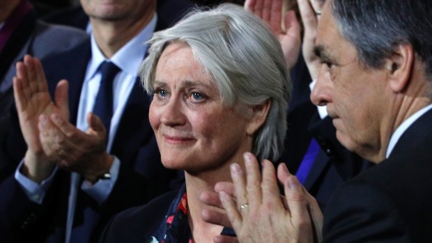 Penelope Fillon, wife of conservative presidential candidate Francois Fillon, right, reacts during a campaign meeting in Paris, on Sunday.