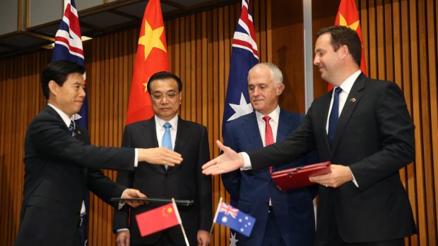 Prime Minister Malcolm Turnbull and Premier Li Keqiang of China with Trade Minister Steve Ciobo during a signing ceremony in Canberra last week.