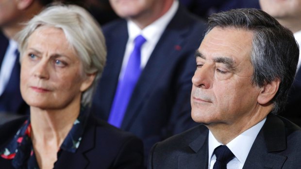 Conservative presidential candidate Francois Fillon and his wife Penelope attend a campaign meeting in Paris in January.