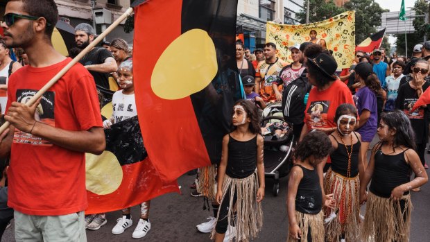 Marchers gather for the Invasion Day rally at The Block in Redfern on Friday. 