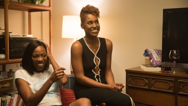 Issa Rae (right) writes, produces and stars in Insecure.