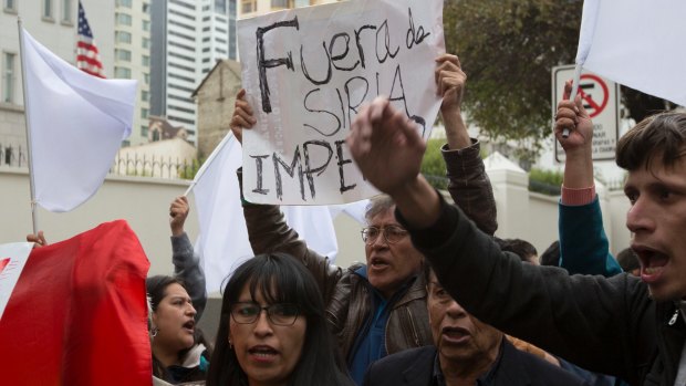 Demonstrators chant slogans during a rally in opposition to the US airstrikes in Syria, in front of the US Embassy in La Paz, Bolivia, on Friday.