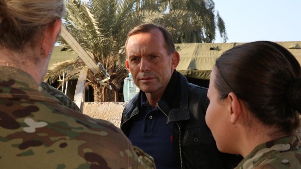 Prime Minister Tony Abbott chats with defence personnel in Baghdad.