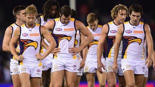 Eagles trudge off Etihad Stadium after their loss to Western Bulldogs. 