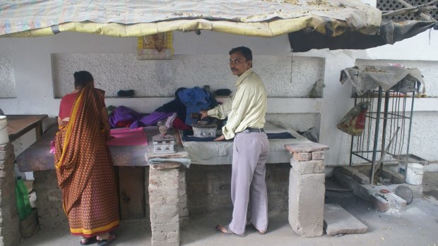 A presswallah who irons the clothes in the Indian capital says he was asked by three clients to deposit 200,000 rupees in his account in return for a payment of 10,000.