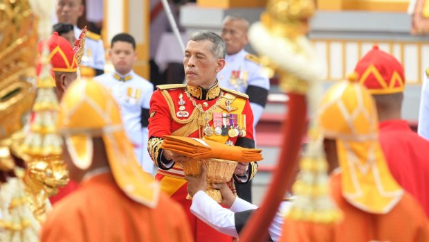 Thailand's King Maha Vajiralongkorn takes part in the funeral of his father, King Bhumibol Adulyadej in Bangkok on Thursday.