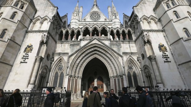 Media gather outside the High Court in London. Mr Justice Peter Jackson has granted the final wishes of a 14-year-old girl to be cryogenically preserved.