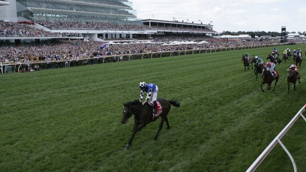 Protectionist, with Ryan Moore in the saddle, streaks away from his rivals to win the Melbourne Cup.