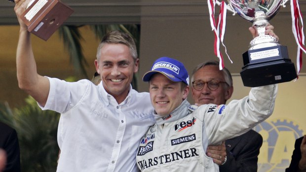 Former McLaren team boss Martin Whitmarsh (left) celebrates F1 success with Kimi Raikkonen in 2005 - now Whitmarsh wants to taste America's Cup success.