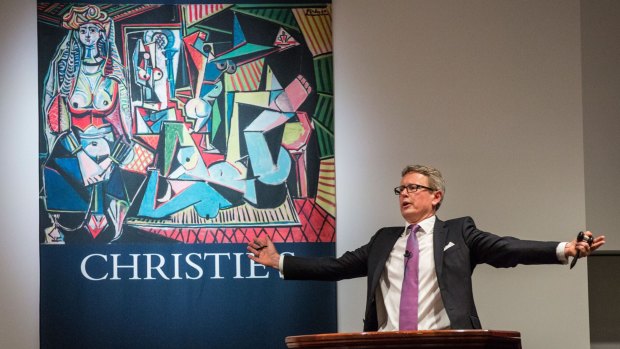 Jussi Pylkkanen, president of Christie's auction house, takes a bid for Picasso's Les Femmes d'Alger.
