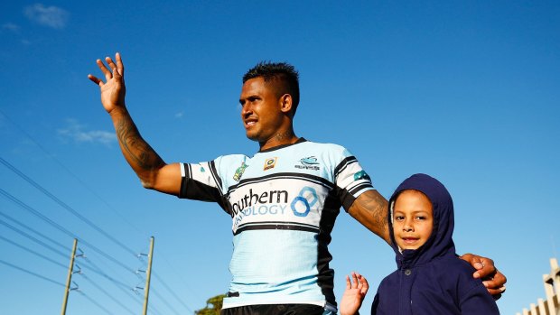Family man: Ben Barba and his daughter Bodhi wave to fans following the round 20 NRL match between the Cronulla Sharks and the Newcastle Knights at Southern Cross Group Stadium.