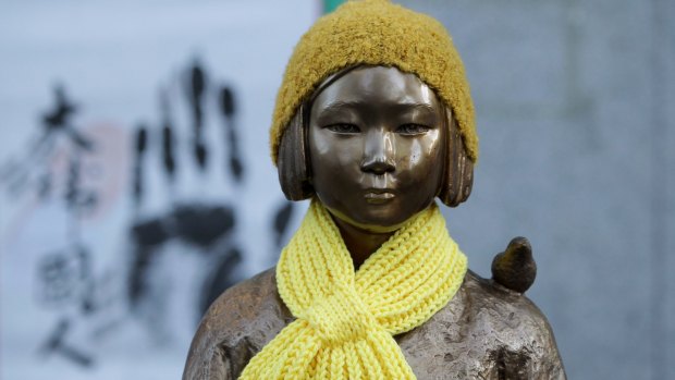 A statue of a girl symbolising the issue of "comfort women" in front of the Japanese Embassy in Seoul, South Korea in 2015.
