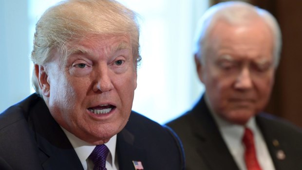 President Donald Trump, left, sitting next to Senator Orrin Hatch. Trump said last Monday at his Cabinet meeting. "We're not getting the job done, and I'm not going to blame myself."