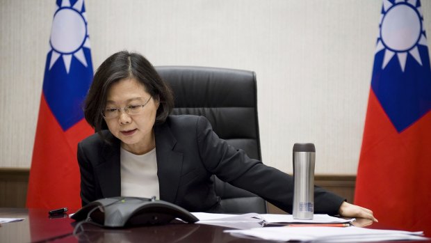 A photo released by Taiwan's Presidential Office shows President Tsai Ing-wen speaking with Donald Trump in Taipei on Friday.