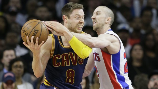 Heavily guarded: Detroit Pistons veteran Steve Blake reaches in on Cleveland Cavaliers playmaker Matthew Dellavedova during the second half in Game 4 in Auburn Hills. The Cavaliers defeated the Pistons 100-98 and swept the series. 