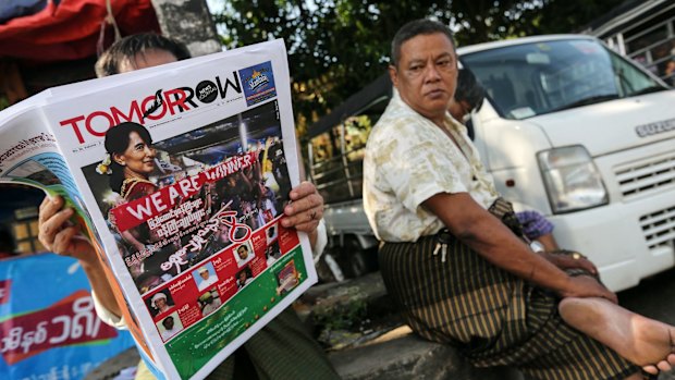 Reading the news in Yangon on Monday. 