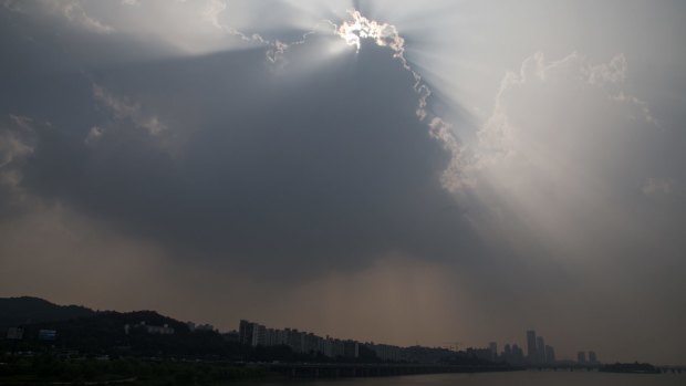 Under threat: The city skyline stands shrouded in haze in Seoul, South Korea.
