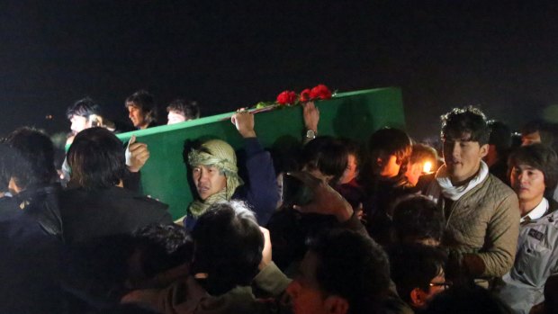 Hazara tribesmen carry the coffin of a beheaded Hazara victim in Kabul on Tuesday. 