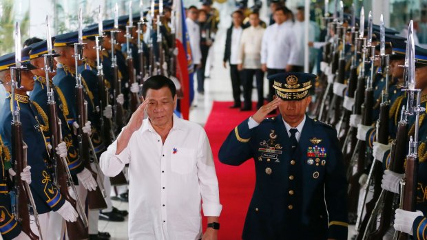 Philippines President Rodrigo Duterte (left)  salutes the honour guard prior to his departure for Cambodia and Singapore.