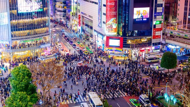 Pedestrians at Shibuya Crossing, Tokyo.