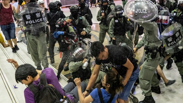 Riot police and protesters clash in a Hong Kong shopping mall at the weekend.