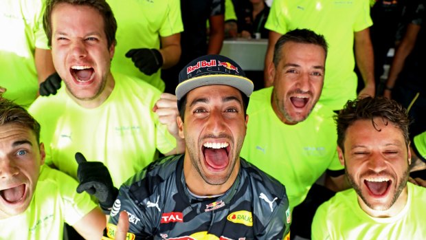 Daniel Ricciardo of Australia and his Red Bull Racing team celebrate after finishing second after the Belgium grand prix.