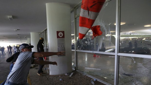 Police officers attempt to break into the Brazilian National Congress during a protest by officers from several Brazilian states against pension reforms.