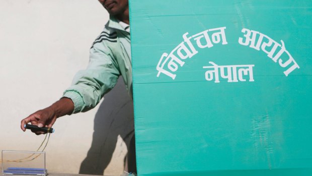 A Nepalese man casts his vote  on Sunday.