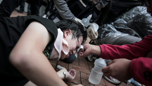 Violent response: Riot police, armed with pepper spray, batons and water hoses, moved in to disperse the demonstrators.