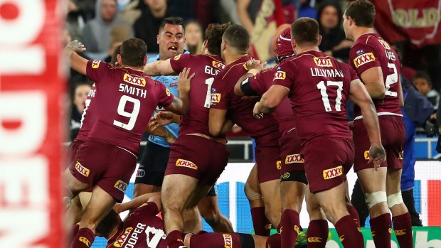 Outnumbered: Andrew Fifita takes on the Maroons.