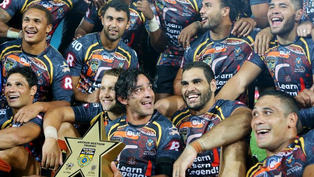 Special feeling: Johnathan Thurston celebrates with his Indigenous All Stars teammates.