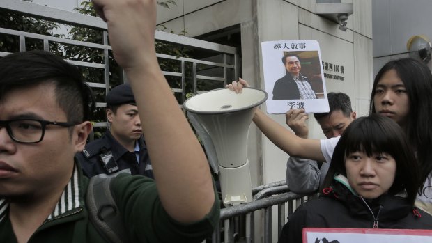 A protester with  a photo of missing bookseller Lee Bo in Hong Kong on Sunday.