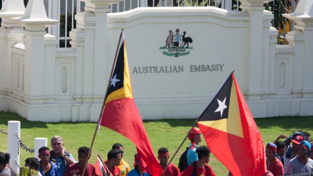 Protesters assembled outside the gates of the Australian embassy in Dili in February, demanding negotiations over the Timor Sea boundary.