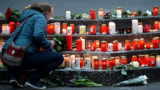 Red and white candles for the victims of the Germanwings plane crash are lit at the Joseph-Koenig Gymnasium secondary school in Haltern am See, Germany.