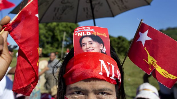 A supporter displays a picture of Myanmar opposition leader Aung San Suu Kyi in her headband earlier this month.