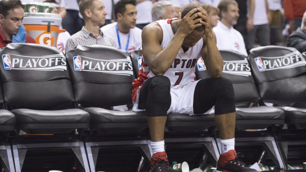 Distraught: Toronto Raptors guard Kyle Lowry on the bench after fouling out during the fourth quarter against the Washington Wizards in Toronto. The Wizards won 93-86 in overtime. 