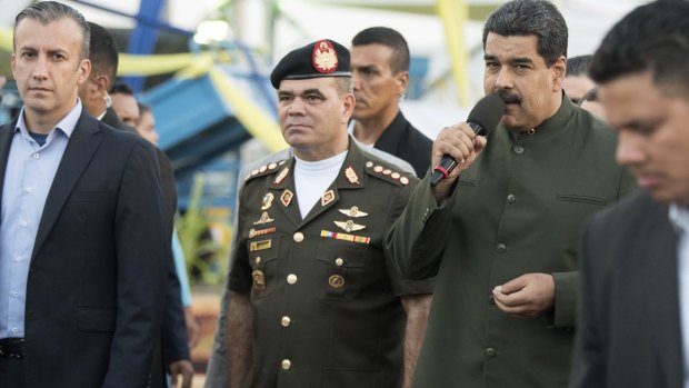 Venezuelan President Nicolas Maduro speaks at an event with Defence Minister General Vladimir Lopez, centre, and Vice-President Tareck El Aissami, left, last week.