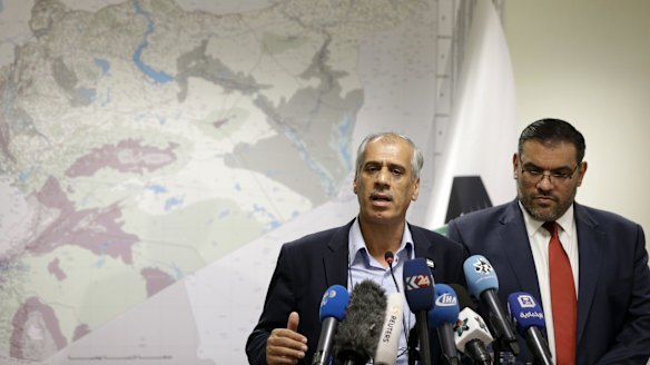 The National Coalition of the Syrian Revolution's "prime minister", Jawad Abu Hatab, left, speaks next to coalition president Anas Abdah in Istanbul on Monday. Abdah hailed the breaching of the Syrian government siege in Aleppo as "miraculous''.
