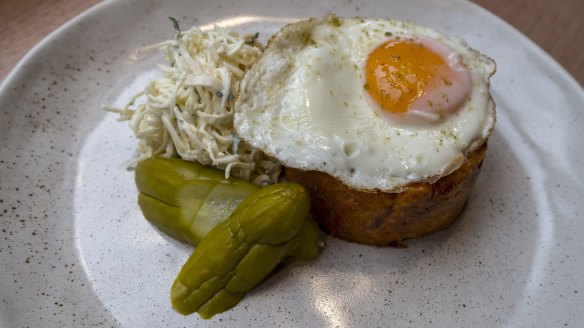 Quiche lorraine topped with a fried egg.