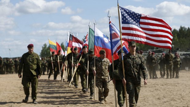 Soldiers from NATO countries attend the opening ceremony of military exercise "Sabre Strike 2015" 60 kilometres north of the Lithuanian capital Vilnius on June 8.